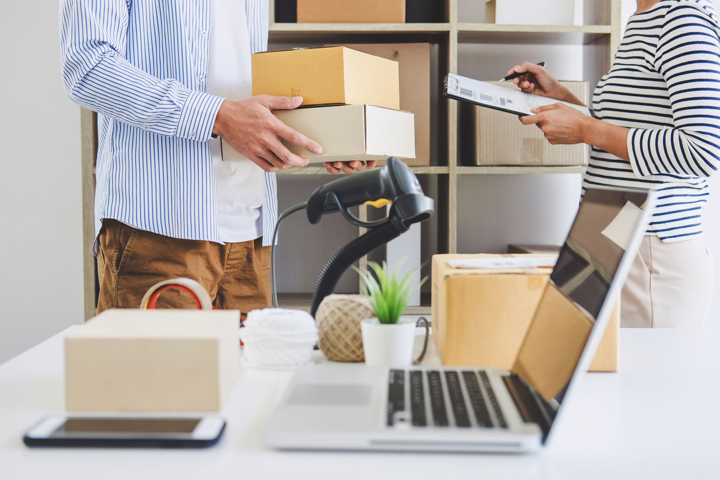 Small business owner delivery service and working packing box, business owner working checking order to confirm before sending customer in post office, Shipment Online Sales